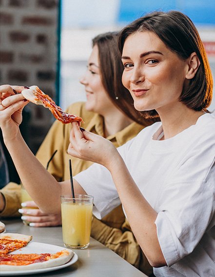 Happy customers enjoying pizza and drinks at A&S Fusion Restro + Bar – asian fusion restaurant vancouver